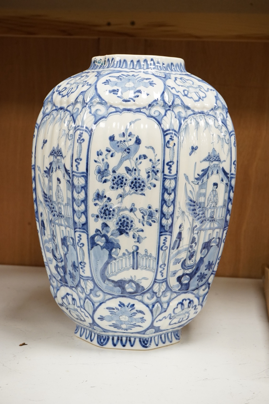 A blue and white delft jar in a chinoiserie style, and a delftware posy vase, tallest 34cm. Condition - fair to good